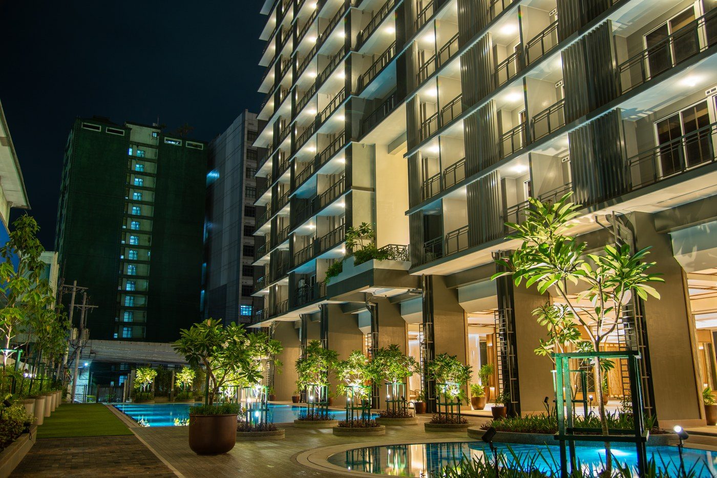 Lap pool at The Oriana lit at night